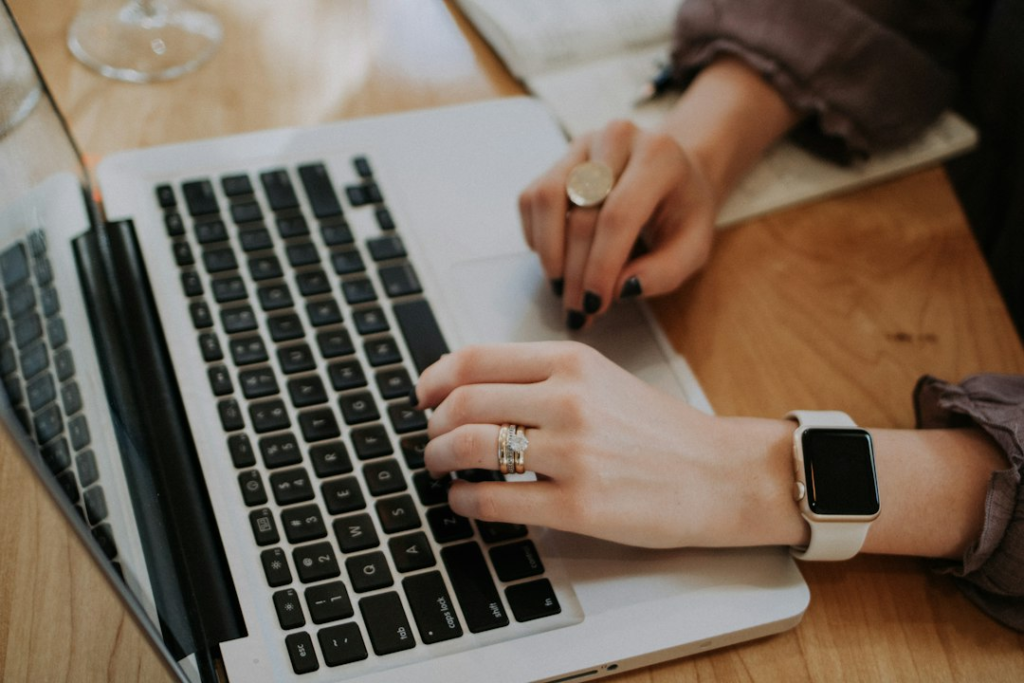 Person searching on a laptop, representing jobs, scholarships and speaking opportunities